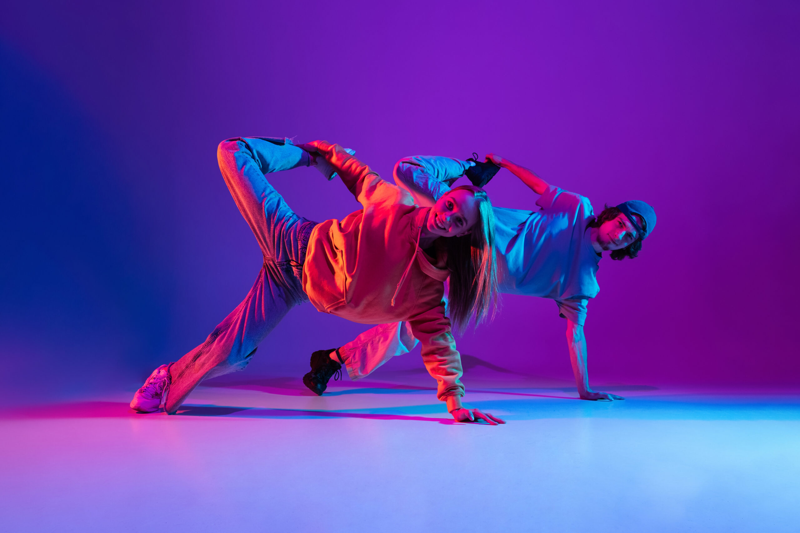 young man and woman dancing hip hop in casual spor 2021 12 09 16 11 52 utc scaled 1